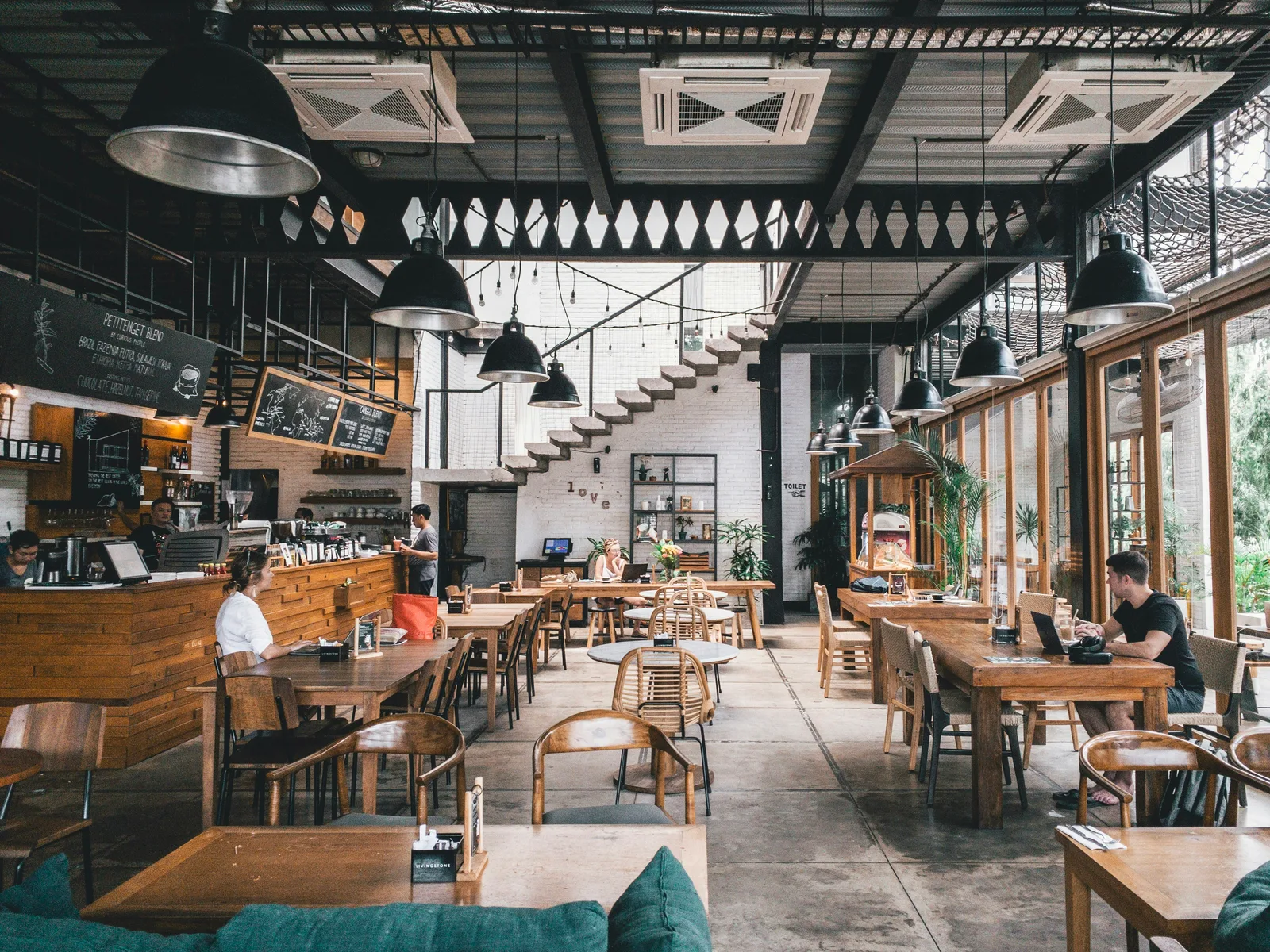 A cozy storefront dining restaurant features a welcoming street-level setup, serving fresh and tasty meals in a warm space. It offers a friendly local spot for quick lunches or relaxed dinners.